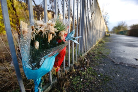 Flowers mark the site of a murder in Cranhill.