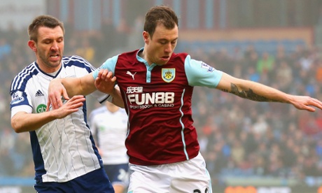 Gareth McAuley of West Brom and Ashley Barnes of Burnley battle for the ball.