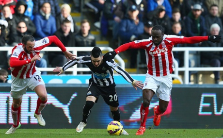 Remy Cabella takes on Marc Wilson (L) and Victor Moses.