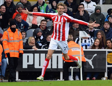 Peter Crouch celebrates as he scores the equaliser.