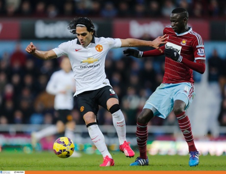 Radamel Falcao holds of Cheikhou Kouyate.