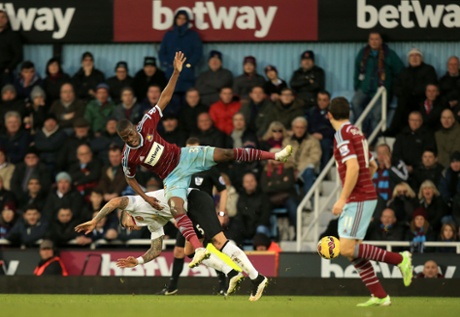 Enner Valencia battles for the ball with Marcos Rojo.