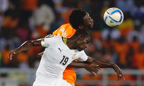 Ivory Coast's Wilfried Bony challenges Ghana's Jonathan Mensah.