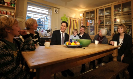 Ed Milliband talks with parents Tom Gray and Sarah Phillis, children Milo and Archie, grandmother Ulla Gray and local MP Harriet Harman at their home in Peckham, south London.