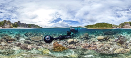 A survey phtoographer filming a reef.