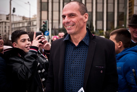 Yanis Varoufakis, Greece’s finance minister, was surrounded by students taking pictures of him as he walked to the Greek parliament earlier today.