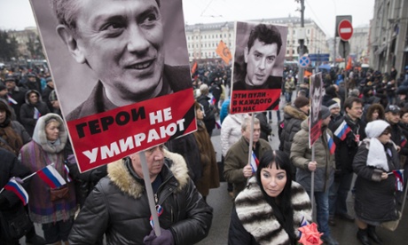 People carry portraits of Boris Nemtsov at a demonstration in Moscow.