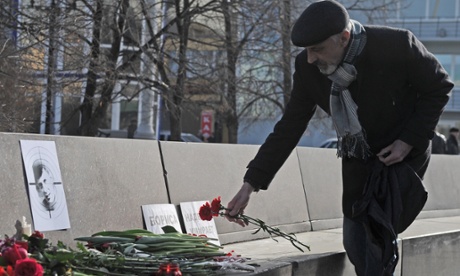 A man leaves flowers in central Ekaterinburg in memory of Nemtsov.