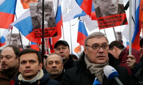 Opposition leader and Russia's former prime minister, Mikhail Kasyanov (R), speaks to the media next to opposition activist Ilya Yashin (L) during the Moscow march.