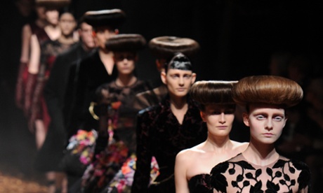 Models present creations during the McQ Alexander McQueen at the London 2012 autumn/winter collection show at London Fashion Week.
