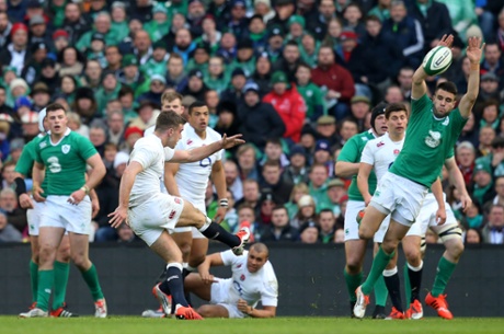 George Ford of England kicks a drop goal past the onrushing Conor Murray.
