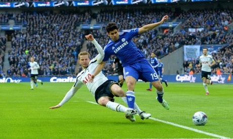 Eric Dier tackles Diego Costa.