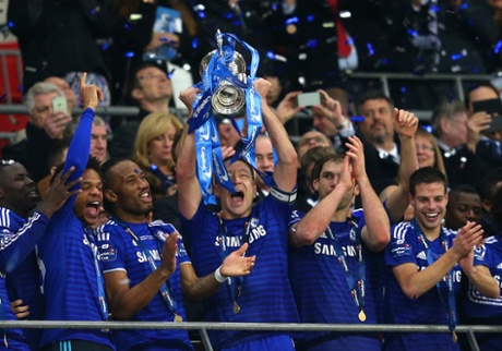 John Terry of Chelsea lifts the Capital One Cup trophy.