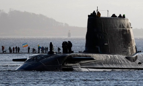 Peace protesters gather on a sand bank as HMS Astute, the first of the biggest hunter-killer submarines to be ordered by Britain's Royal Navy, sails into the River Clyde.