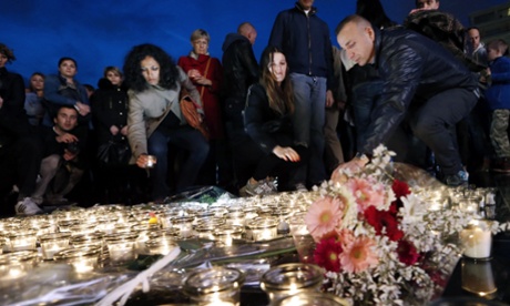 Mourners in Nice pay tribute to Camille Muffat on Tuesday.