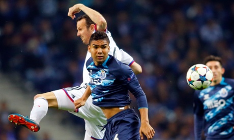 Porto's Carlos Casemiro fights for the ball with FC Basel's Marco Streller.
