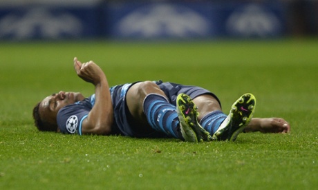 Porto's Danilo lies on the pitch after colliding with goalkeeper Fabiano.