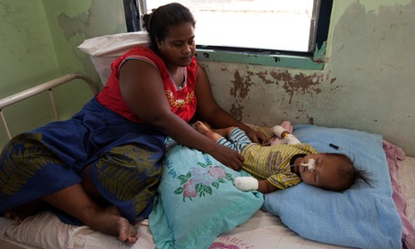 Katewea Atanimatang from Bikenibeu, South Tarawa, looks after her one-year-old baby Atanimatang Atanimatang who is in hospital suffering severe dehydration and malnutrition.