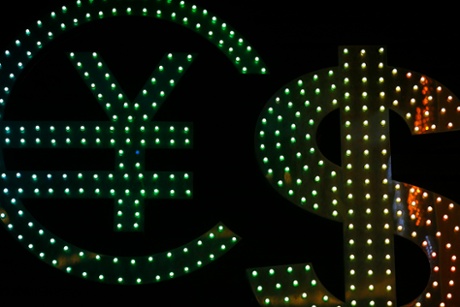 Signs for the dollar, euro and other currencies are seen at a currency exchange shop in Hong Kong