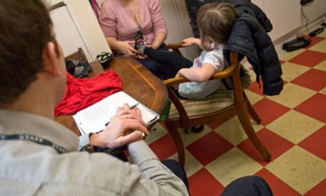 A recently qualified child protection social worker on a home visit .