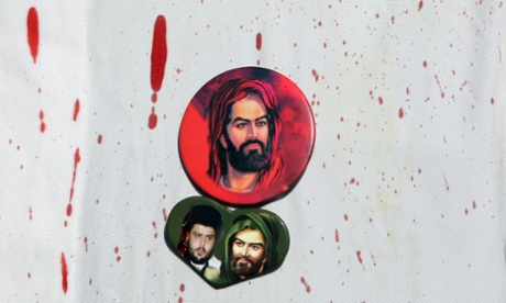Pictures of Imam Hussein (top and right) and Iraqi Shiite cleric Moqtada al-Sadr (left) on the blood-stained shirt of an Iraqi Shiite man taking part in Ashura rituals in Baghdad's Sadr City.