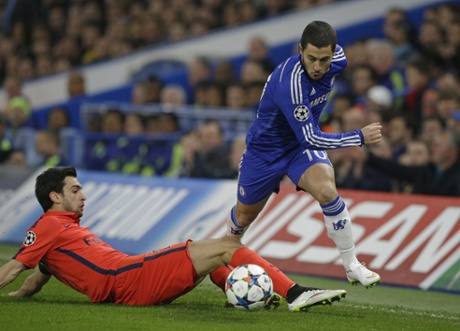 Eden Hazard passes PSG's Javier Pastore.