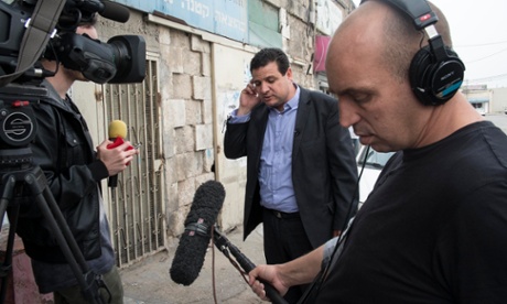 As evidence of the new celebrity status of the leader of the Israeli Arab Joint List, Ayman Odeh fields questions from a television crew in Lod while campaigning about his favourite films and music. 