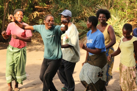 African Moringa and Permaculture Project manager Samuel Baluti (left of centre) leading Malawi-style motivational singing