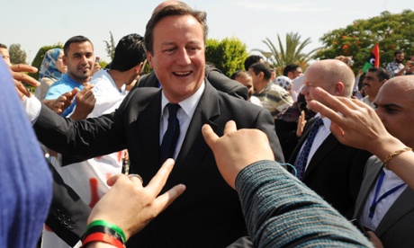 David Cameron visits Libya after the British air strikes.