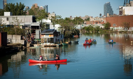 Canoers paddle on the Gowanus Canal in Brooklyn.