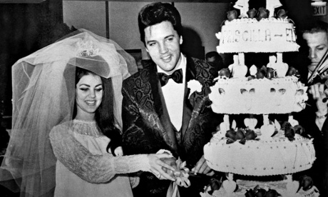 Elvis and Priscilla Presley cut their wedding cake