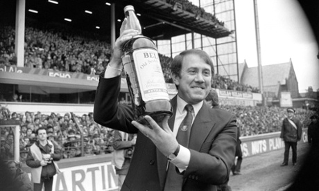 Everton manager Howard Kendall lifts the giant bottle of Bell's whisky, his prize for winning Bell's Manager of the Year