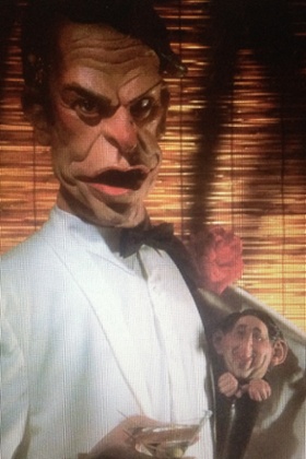 David Steele depicted as hiding in David Owen’s pocket by Spitting Image