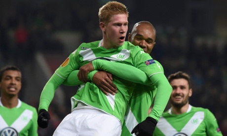 VfL Wolfsburg's Kevin de Bruyne is congratulated by his team mate Naldo after scoring a second goal against Inter Milan.