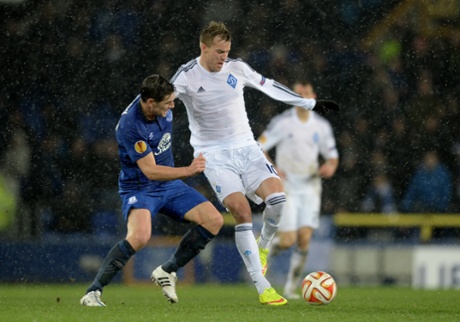 Andriy Yarmolenko is challenged by Gareth Barry.