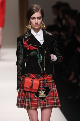 A model in a Munro-esque kilt on the Moschino catwalk