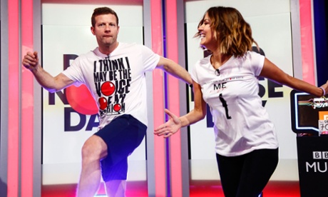 Dermot O'Leary boogies with with Caroline Flack during his 24-hour danceathon for Comic Relief