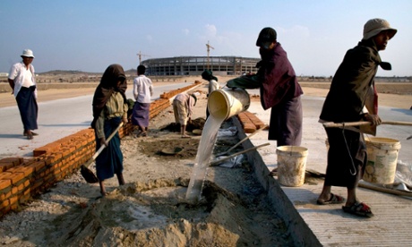 Workers build a road in Naypyidaw.