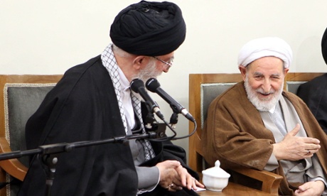 Ayatollah Ali Khamenei (left) speaking to Mohammad Yazdi, chairman of Iran’s Assembly of Experts, during a meeting with members of the assembly in Tehran.