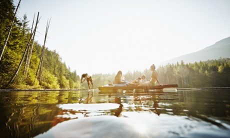 Group of friends hanging out on floating dock, Canada