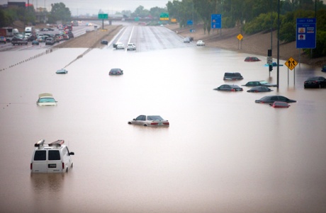 Cars are stuck in flood waters on I-10 east at 43rd Ave. after heavy storms pounded the Phoenix area early Monday, flooding major freeways, prompting several water rescues and setting an all-time single-day record for rainfall in the desert city, 8 September 2014.