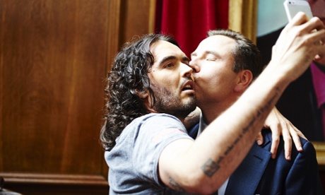 Russell Brand takes a selfie as he's kissed by David Walliams as part of this year's Comic Relief.