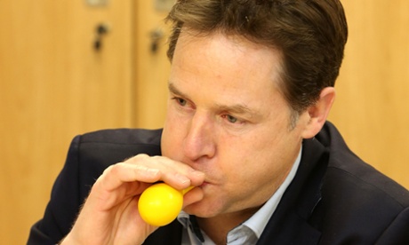 Clegg blows up a balloon as he takes part in a therapy session during a visit to Clock View Hospital