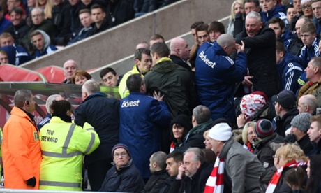Angry Sunderland fans try to get to the dug-out where manager Gus Poyet is, during Aston Villa's 4-0 win.