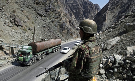 Afghan national army officers keep vigil from a check point on Kabul-Jalalabad highway on the outskirts of Kabul.