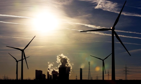 Wind turbines in front of the RWE brown coal-fired power plant near Bergheim, Germany.  A new study concludes that wind energy is far cheaper than coal, when accounting for all costs.