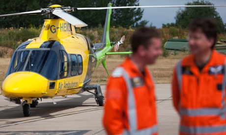 An air Ambulance helicopter and two pilots.