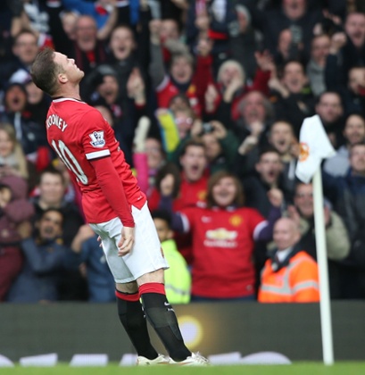 Wayne Rooney milks the moment with the United faithful.