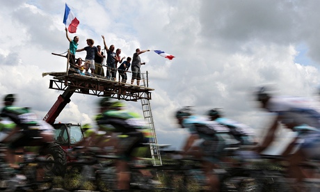 Fans wave a French flag at the Tour de France 2012