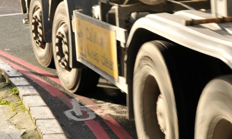 A lorry drives over a cycling sign at Old Street roundabout in London.